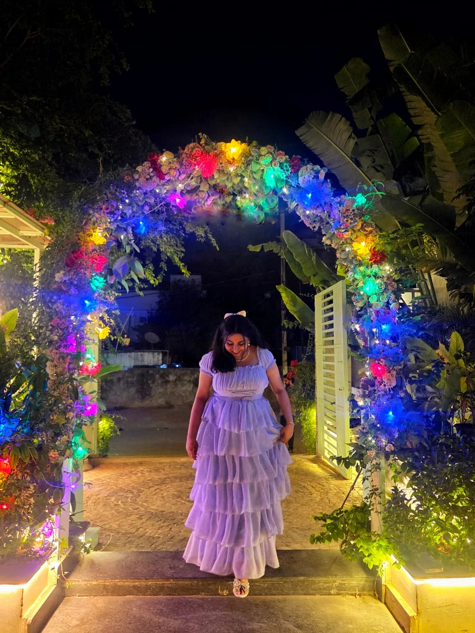 Birthday portrait under floral lights